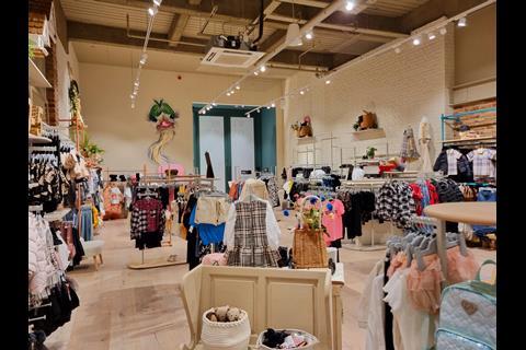 Interior of River Island's River Studios store in Derby, showing racks of childrenswear